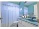Bathroom features a single vanity, a toilet, and a shower with a charming blue theme at 4622 Secret River Trl, Port Orange, FL 32129