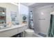 Bathroom featuring a shower, sink, and toilet with coordinated decor and a clean, bright atmosphere at 4622 Secret River Trl, Port Orange, FL 32129
