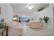 Inviting living room featuring high ceilings, neutral tile flooring, and comfortable seating arrangement at 4622 Secret River Trl, Port Orange, FL 32129
