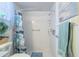 Clean shower with a modern shower head, convenient shelving, and a decorative shower curtain at 4622 Secret River Trl, Port Orange, FL 32129