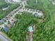 An aerial shot showcasing the community nestled among lush greenery and serene lakes in a peaceful setting at 5 Cantilever Ct, Ormond Beach, FL 32174