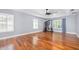 Spacious bedroom boasts hardwood flooring, natural light, and ample room for exercise equipment at 5 Cantilever Ct, Ormond Beach, FL 32174