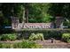 The Hunter's Ridge entrance sign is surrounded by lush greenery and landscaping at 5 Cantilever Ct, Ormond Beach, FL 32174