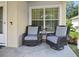 Cozy front porch with comfortable seating, perfect for relaxing and enjoying the neighborhood views at 5 Cantilever Ct, Ormond Beach, FL 32174