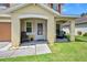 Inviting front porch with seating, offering a relaxing spot to enjoy the outdoors at 5 Cantilever Ct, Ormond Beach, FL 32174
