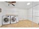 Bright laundry room with modern appliances and ample shelving for storage at 5 Cantilever Ct, Ormond Beach, FL 32174