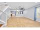 Open-concept living room featuring tile flooring, a modern ceiling fan, and ample natural light at 5 Cantilever Ct, Ormond Beach, FL 32174