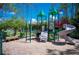This community features a recreational playground with slides and climbing structures surrounded by towering trees at 5 Cantilever Ct, Ormond Beach, FL 32174