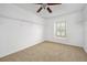 Walk-in closet featuring carpet, shelving, and a window providing natural light at 5 Cantilever Ct, Ormond Beach, FL 32174