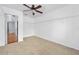 Spacious walk-in closet featuring carpet, shelving, and bright natural light at 5 Cantilever Ct, Ormond Beach, FL 32174