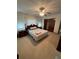 Main bedroom with carpet, ceiling fan, bed, and closet at 9393 Sw 102Nd Pl, Ocala, FL 34481