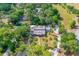 Sprawling estate with lush landscaping, a pool, and multiple structures at 1159 Magnolia Ave, Daytona Beach, FL 32114