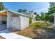 Lush backyard showcases mature trees, a pool, and a charming two-story home at 1159 Magnolia Ave, Daytona Beach, FL 32114