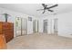 Bedroom with carpeted floor, ceiling fan, and closets at 1159 Magnolia Ave, Daytona Beach, FL 32114