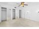 Bright bedroom with a ceiling fan and mirrored closet doors offers ample storage space at 1159 Magnolia Ave, Daytona Beach, FL 32114