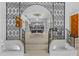 Elegant dining room featuring unique ironwork arch and view of a modern dining set and decor at 1159 Magnolia Ave, Daytona Beach, FL 32114