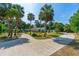 Beautiful home with circular driveway, lush landscaping, mature trees, and well-maintained grounds at 1159 Magnolia Ave, Daytona Beach, FL 32114