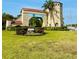 Historical gate surrounded by lush lawn and shrubbery, showcasing Daytona heritage at 1159 Magnolia Ave, Daytona Beach, FL 32114