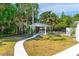 Backyard gazebo offers a peaceful retreat with outdoor seating and a lush lawn at 1159 Magnolia Ave, Daytona Beach, FL 32114