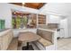 Bright kitchen features a built-in dining nook and view to backyard at 1159 Magnolia Ave, Daytona Beach, FL 32114