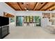 Spacious living room with wood-paneled ceiling and views of the backyard at 1159 Magnolia Ave, Daytona Beach, FL 32114