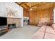 Spacious room with fireplace and exposed wood beamed ceiling at 1159 Magnolia Ave, Daytona Beach, FL 32114