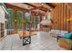 Enclosed outdoor area featuring a pool, dining table, and outdoor bar at 1159 Magnolia Ave, Daytona Beach, FL 32114