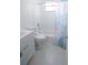 Cozy bathroom with a tiled tub, a new vanity, and a toilet at 1301 Oakwood Ave, Daytona Beach, FL 32114
