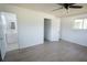 Bright and airy bedroom with a closet, en-suite bathroom, and grey wood-look flooring at 1301 Oakwood Ave, Daytona Beach, FL 32114