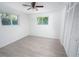 Neutral bedroom with two windows allowing natural light and a closet for storage at 1301 Oakwood Ave, Daytona Beach, FL 32114