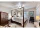 Bedroom with a four poster bed, ceiling fan, closet, carpeted floor and neutral wall color at 1465 Admrial Nimitz Ave, Daytona Beach, FL 32124