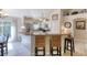 Bright kitchen with breakfast bar, stainless steel appliances and white cabinets at 1465 Admrial Nimitz Ave, Daytona Beach, FL 32124