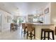 Kitchen with breakfast bar, stainless steel appliances and white cabinets at 1465 Admrial Nimitz Ave, Daytona Beach, FL 32124