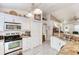 Bright kitchen features stainless steel appliances, tile floor, and granite countertops at 1465 Admrial Nimitz Ave, Daytona Beach, FL 32124