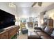Open-concept living space flows into kitchen area with tile flooring and modern fixtures at 1465 Admrial Nimitz Ave, Daytona Beach, FL 32124