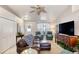 Comfortable living room with tile flooring, plush seating, and bright natural light at 1465 Admrial Nimitz Ave, Daytona Beach, FL 32124