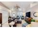 Relaxing living room featuring a ceiling fan, tile flooring and comfortable furniture at 1465 Admrial Nimitz Ave, Daytona Beach, FL 32124