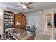 Home office space featuring built-in bookshelves, large desk, neutral walls and carpeted floors at 1465 Admrial Nimitz Ave, Daytona Beach, FL 32124