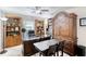 Home office space featuring built-in bookshelves, large desk, neutral walls and carpeted floors at 1465 Admrial Nimitz Ave, Daytona Beach, FL 32124
