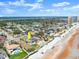 Expansive aerial shot of the property on the beachfront, nestled within the coastal neighborhood at 1504 N Atlantic Ave, Daytona Beach, FL 32118