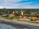 This beach home boasts panoramic ocean views and direct access to the sandy shore at 1504 N Atlantic Ave, Daytona Beach, FL 32118