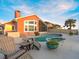 Inviting backyard featuring a pool, patio, and plenty of space for outdoor activities and entertaining at 1504 N Atlantic Ave, Daytona Beach, FL 32118