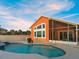 Outdoor pool and patio area, providing a relaxing space for leisure and enjoying the sunshine at 1504 N Atlantic Ave, Daytona Beach, FL 32118