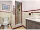 Tiled bathroom featuring a vintage look with a standing shower and basin sink at 1504 N Atlantic Ave, Daytona Beach, FL 32118