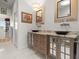 Elegant bathroom featuring double vanity with granite countertop and vessel sinks at 1504 N Atlantic Ave, Daytona Beach, FL 32118