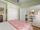 Comfortable bedroom featuring a plush bed, ceiling fan and closet at 1504 N Atlantic Ave, Daytona Beach, FL 32118