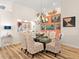 Elegant dining room with glass table, seating for six, and decorative wall accents at 1504 N Atlantic Ave, Daytona Beach, FL 32118