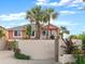 Beautifully landscaped home with a white picket gate and lush tropical greenery surrounding the property at 1504 N Atlantic Ave, Daytona Beach, FL 32118