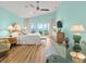 Light and airy main bedroom with vaulted ceiling, ceiling fan, and sliding glass doors to deck with ocean view at 1504 N Atlantic Ave, Daytona Beach, FL 32118