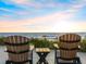 Relaxing outdoor seating area with a table offers stunning ocean views and a serene atmosphere at 1504 N Atlantic Ave, Daytona Beach, FL 32118